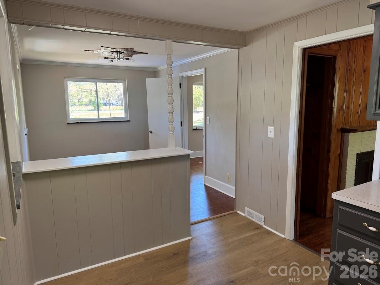 4424 Back Creek Church Road Charlotte, NC 28213 - Photo 6 of 15 a view of an empty room with wooden floor and a window