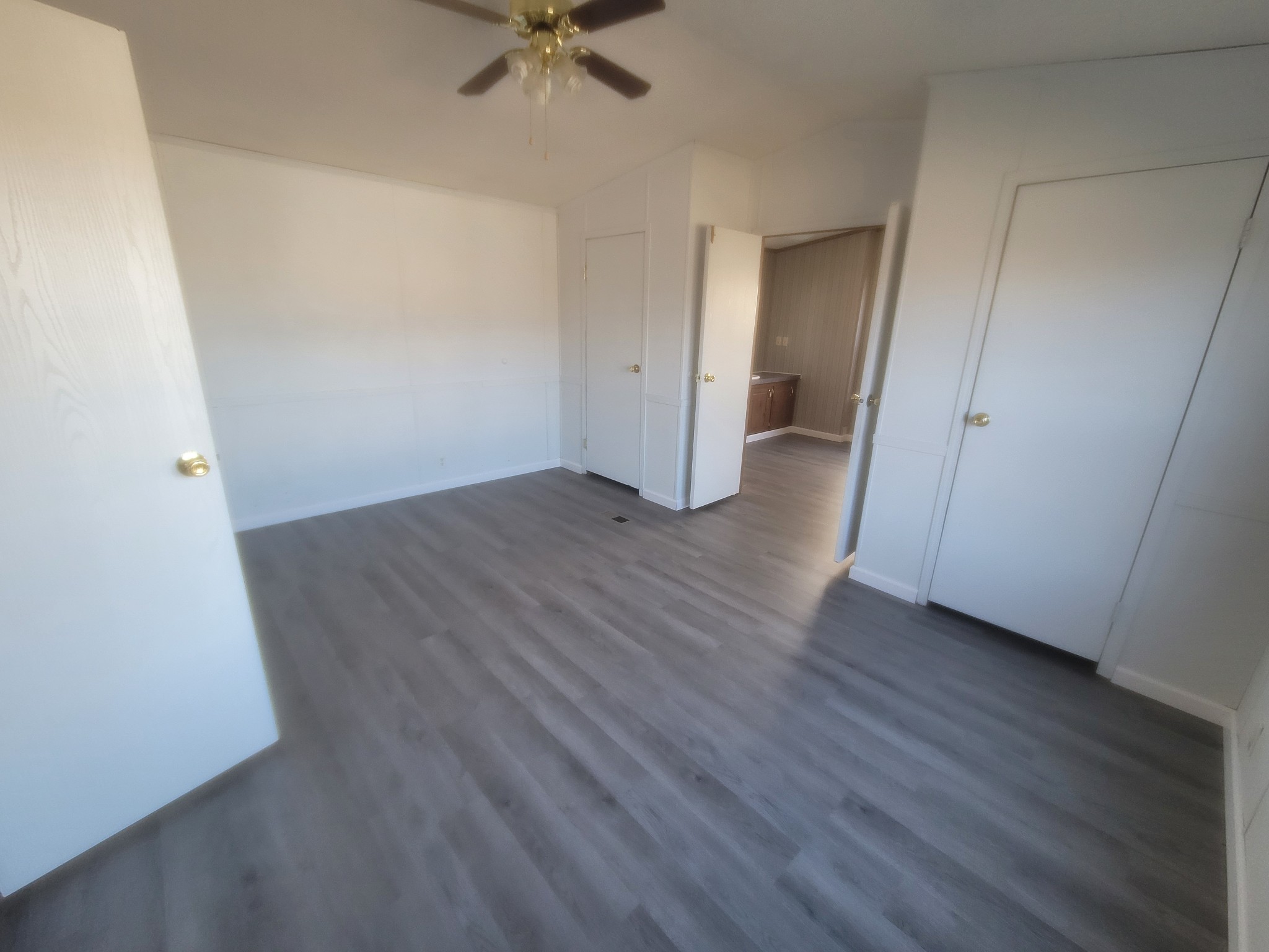 2918 Bryant Ridge Road Baxter, TN 38544 - Photo 6 of 15 an empty room with wooden floor and white walls
