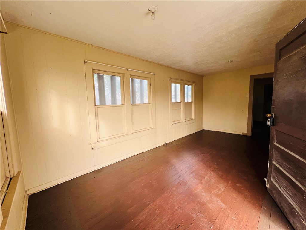 602 West Rice Street Falfurrias, TX 78355 - Photo 2 of 15 a view of empty room with wooden floor
