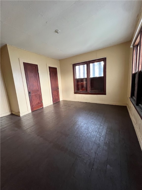 602 West Rice Street Falfurrias, TX 78355 - Photo 7 of 15 a view of an empty room with wooden floor and a window