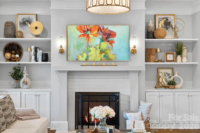 a living room with furniture and a fireplace