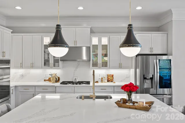 a kitchen with refrigerator and cabinets