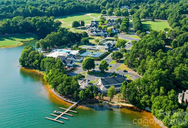 an aerial view of residential house with outdoor space and swimming pool
