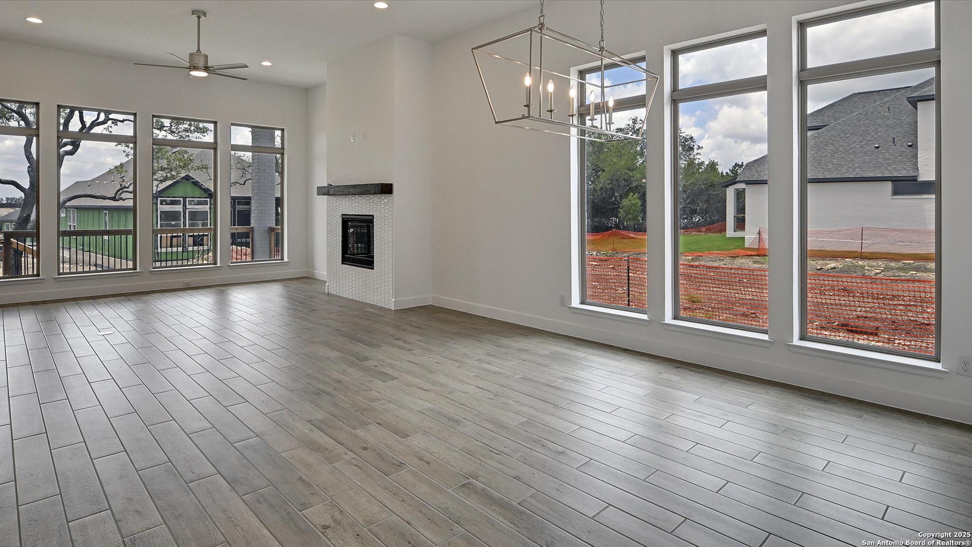 213 Fandango Boerne, TX 78006 - Photo 11 of 35 an empty room with wooden floor and outdoor view
