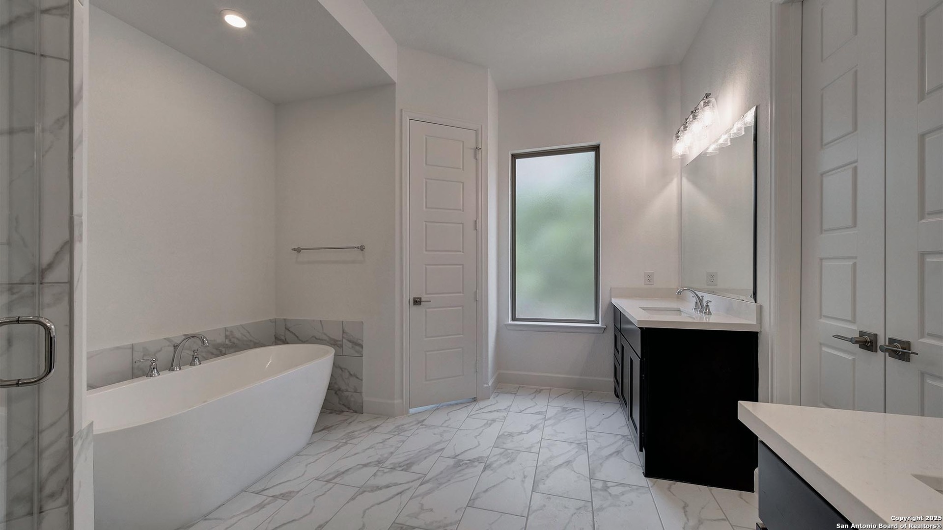 213 Fandango Boerne, TX 78006 - Photo 16 of 35 a bathroom with a bathtub and a sink