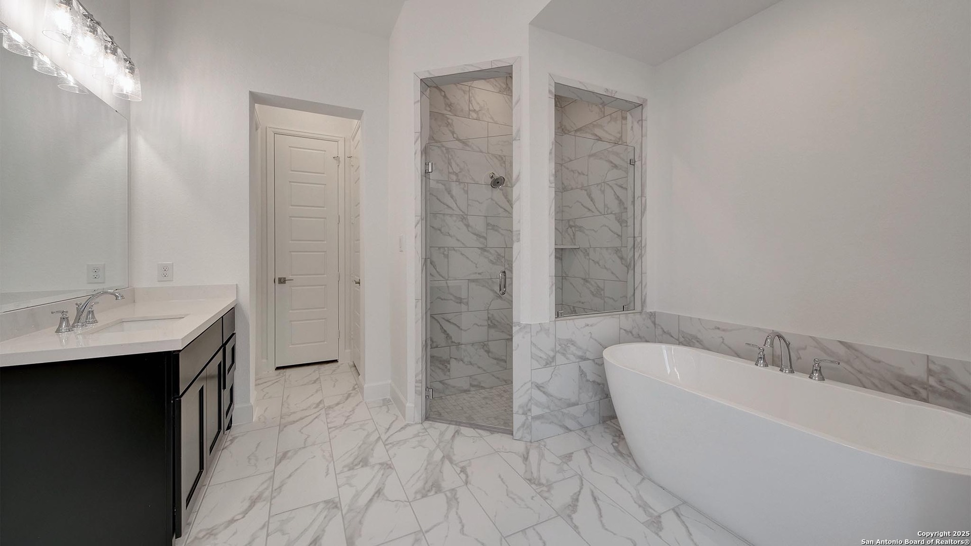 213 Fandango Boerne, TX 78006 - Photo 17 of 35 a bathroom with a bathtub and a sink