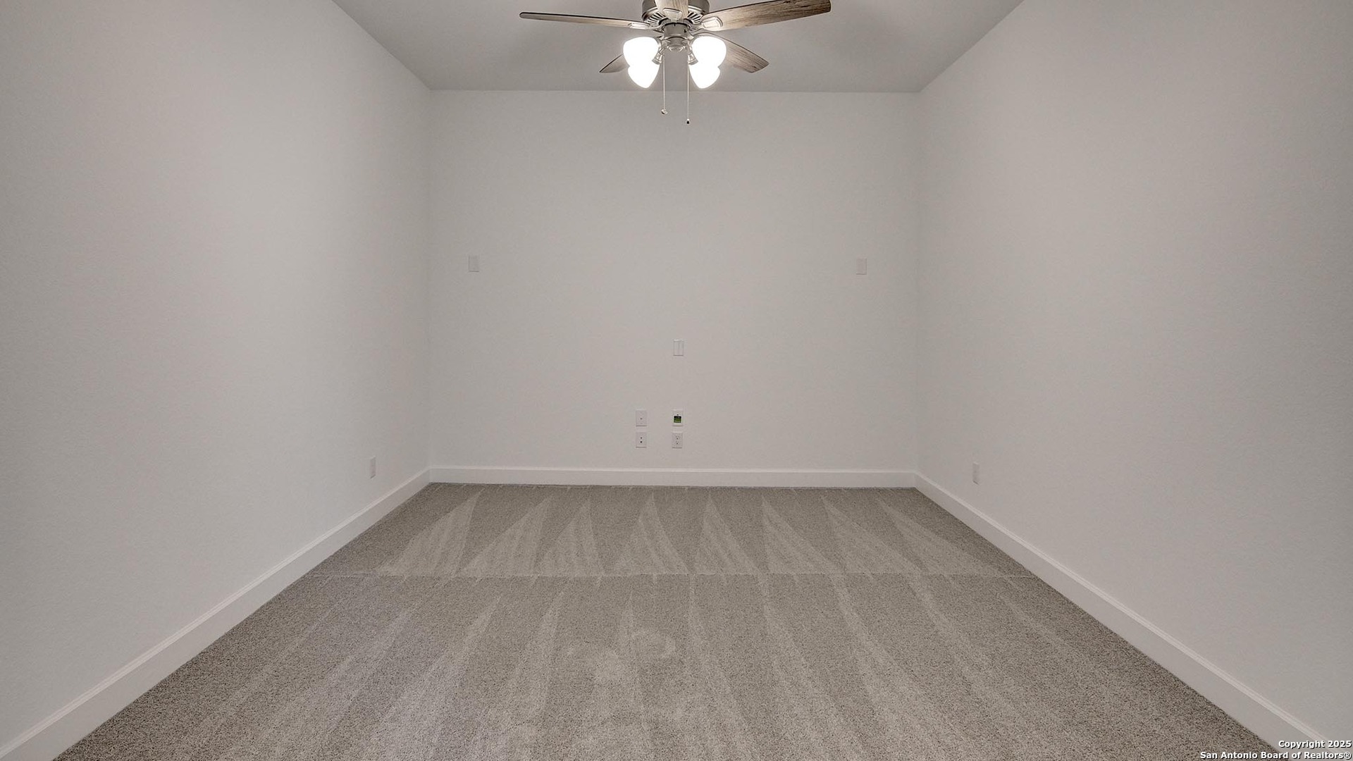 213 Fandango Boerne, TX 78006 - Photo 27 of 35 a view of an empty room with a chandelier fan