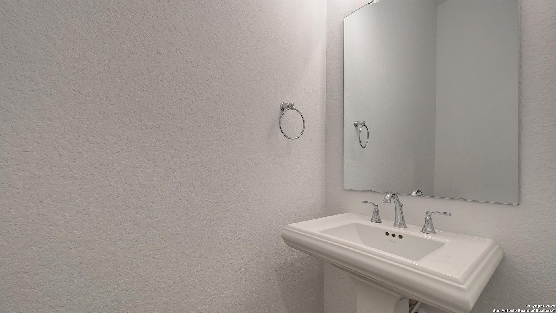 213 Fandango Boerne, TX 78006 - Photo 28 of 35 a bathroom with a sink and a mirror
