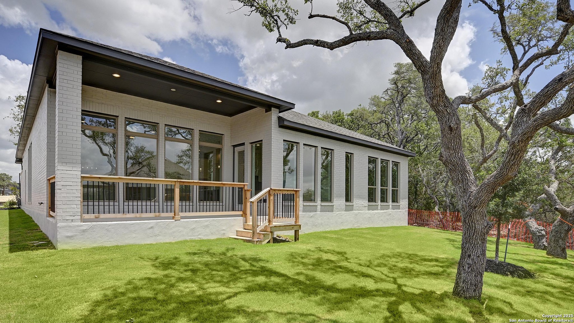 213 Fandango Boerne, TX 78006 - Photo 32 of 35 a house with tall trees in the background