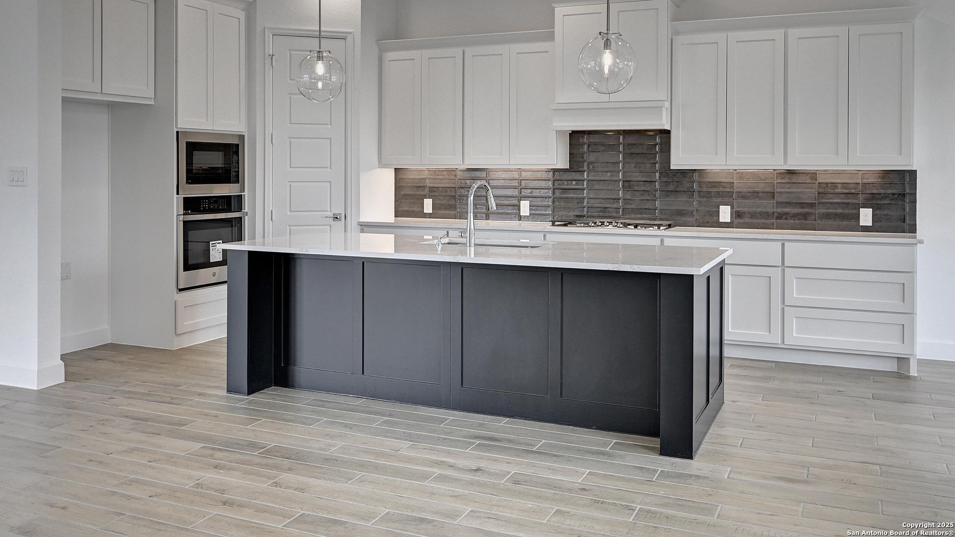 213 Fandango Boerne, TX 78006 - Photo 5 of 35 a kitchen with stainless steel appliances granite countertop a sink and cabinets