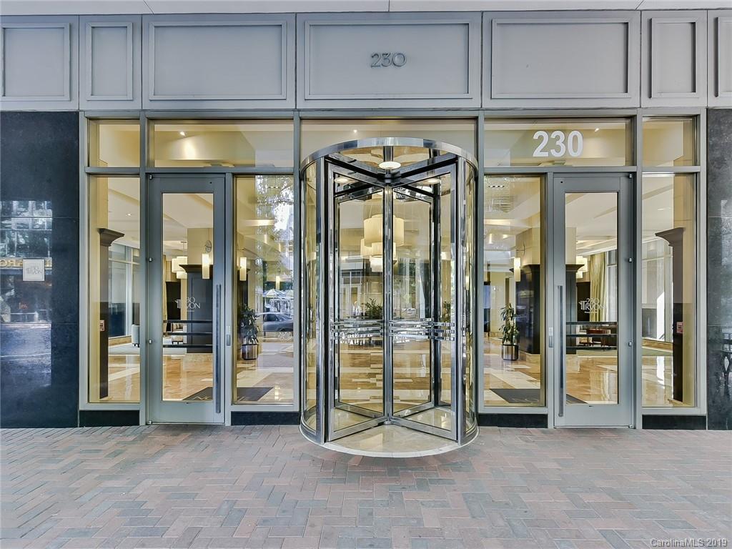230 South Tryon Street, Unit 710 Charlotte, NC 28202 - Photo 2 of 48 a view of a glass door with a glass top table