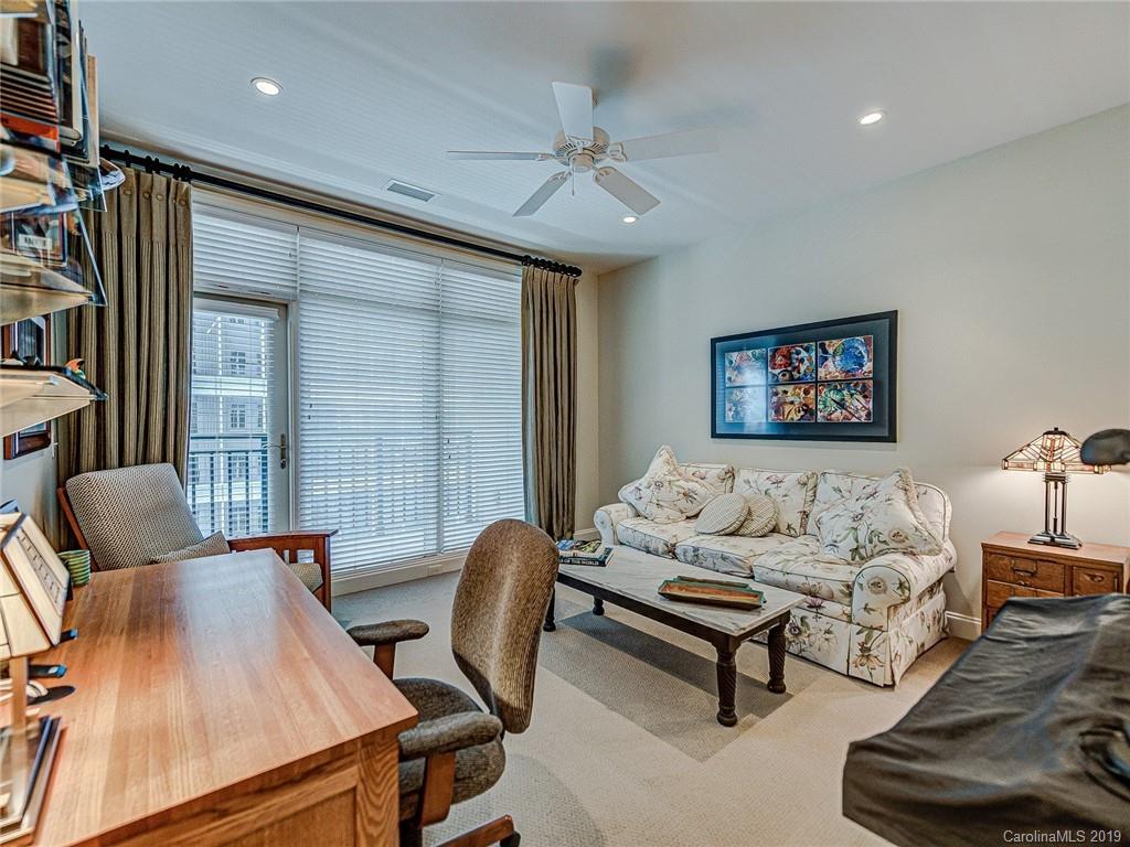 230 South Tryon Street, Unit 710 Charlotte, NC 28202 - Photo 28 of 48 a living room with furniture