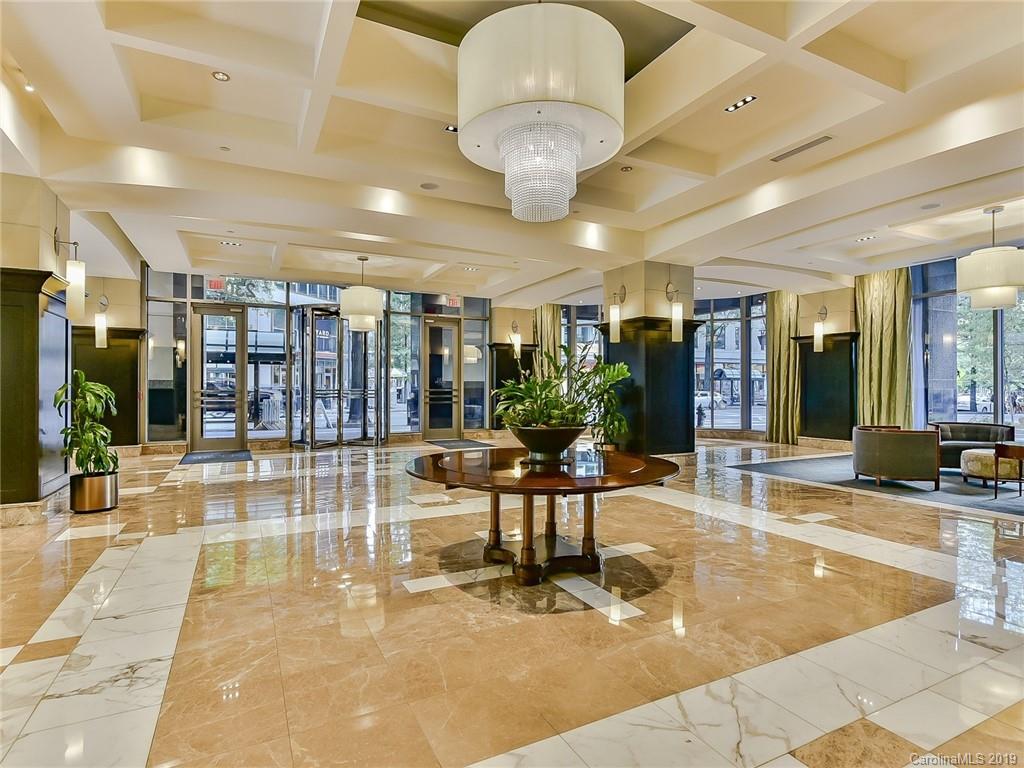 230 South Tryon Street, Unit 710 Charlotte, NC 28202 - Photo 4 of 48 a view of a lobby with gym equipment