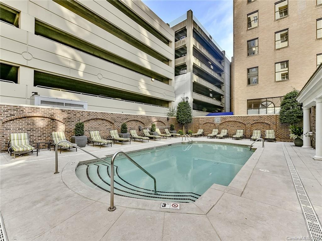 230 South Tryon Street, Unit 710 Charlotte, NC 28202 - Photo 36 of 48 a view of a swimming pool with outdoor seating