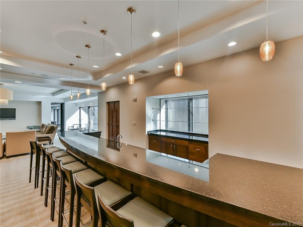 230 South Tryon Street, Unit 710 Charlotte, NC 28202 - Photo 39 of 48 a lobby with furniture and window