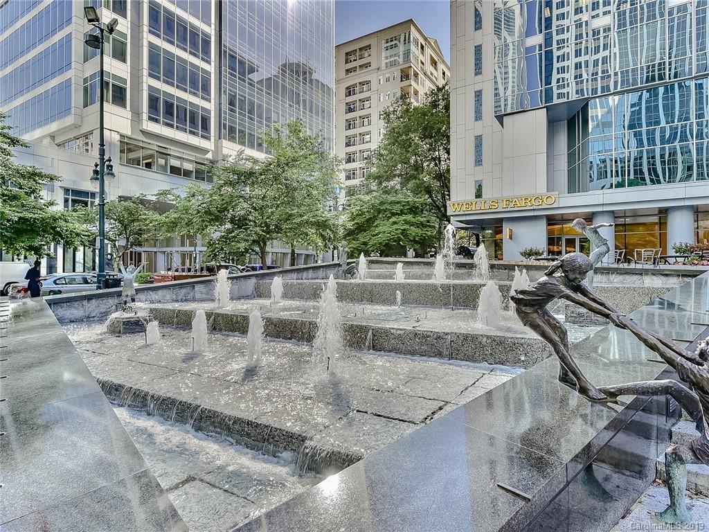 230 South Tryon Street, Unit 710 Charlotte, NC 28202 - Photo 46 of 48 a view of a swimming pool with a patio