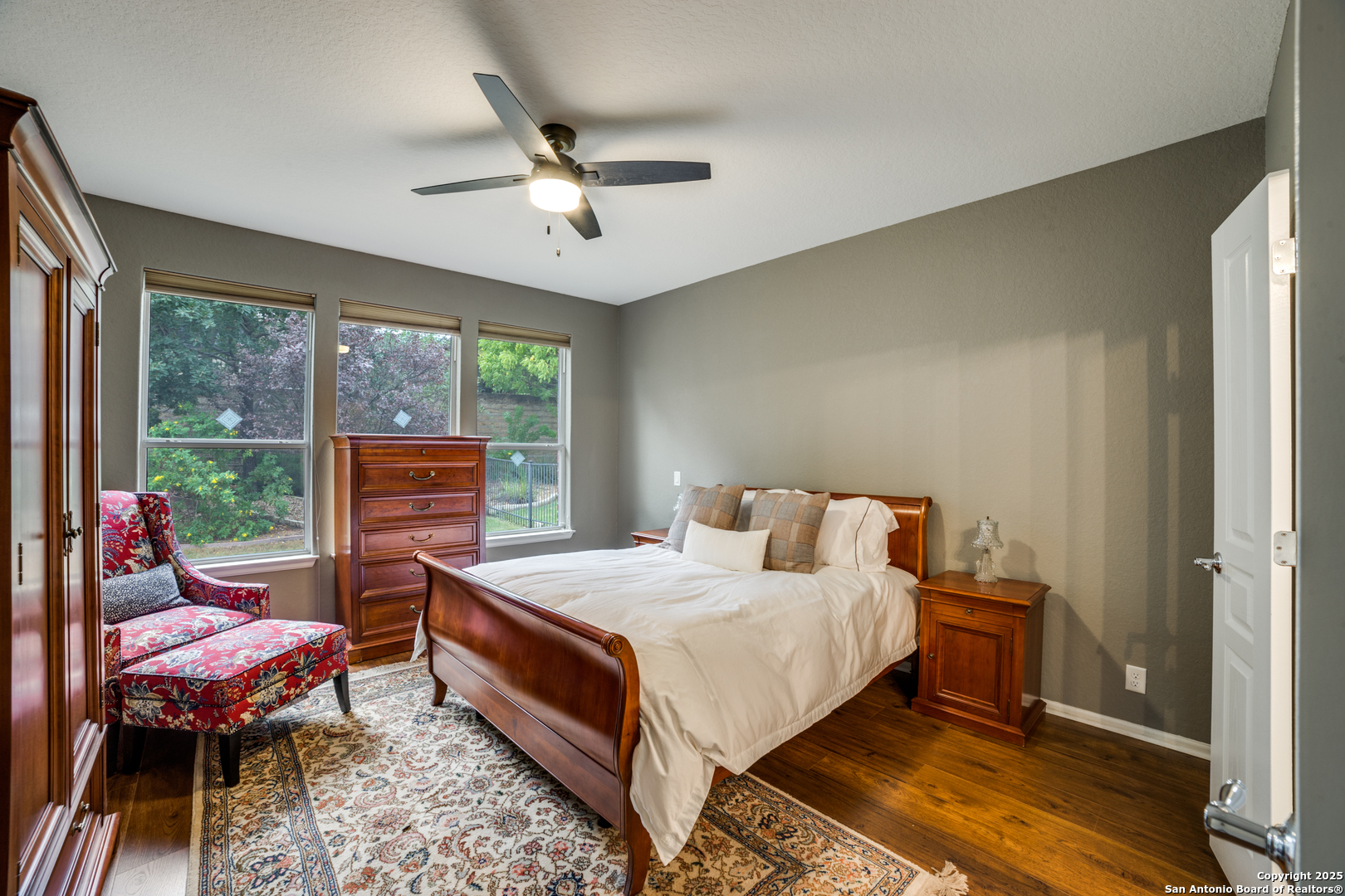 12434 Modena Bay San Antonio, TX 78253 - Photo 13 of 25 a bedroom with a bed and wooden floor