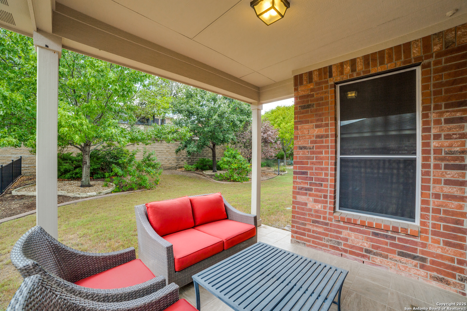 12434 Modena Bay San Antonio, TX 78253 - Photo 18 of 25 a backyard of a house with seating space