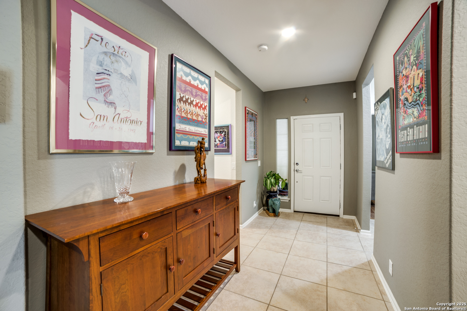 12434 Modena Bay San Antonio, TX 78253 - Photo 4 of 25 a hall with a sink cabinets and wooden floor