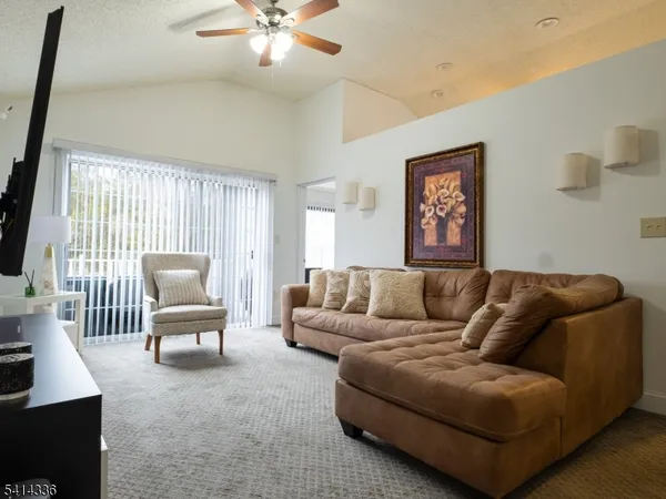 a kitchen with stainless steel appliances granite countertop a refrigerator a stove a microwave and cabinets