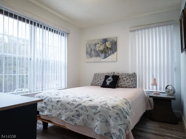 a bathroom with a sink a toilet and a large mirror