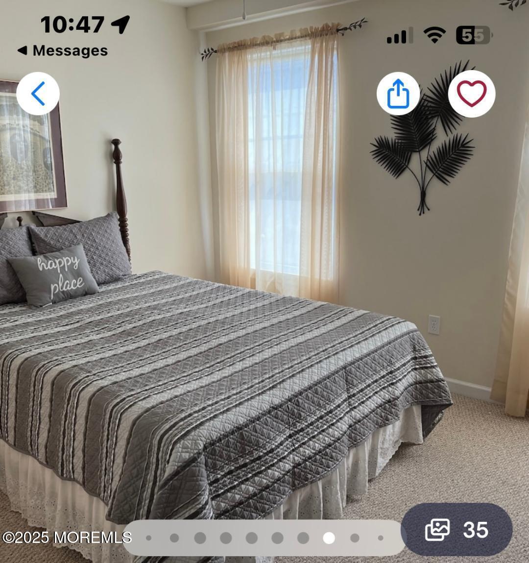 1301 Ocean Boulevard, Unit 1 Seaside Heights, NJ 08751 - Photo 3 of 13 a bedroom with a bed and a window