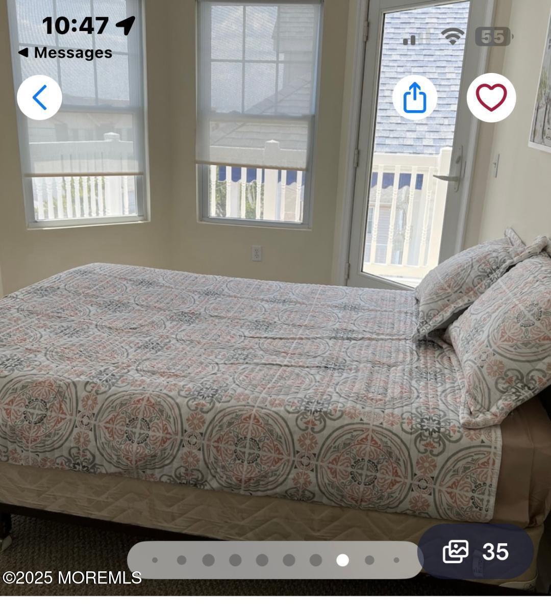 1301 Ocean Boulevard, Unit 1 Seaside Heights, NJ 08751 - Photo 5 of 13 a bedroom with a bed and a window