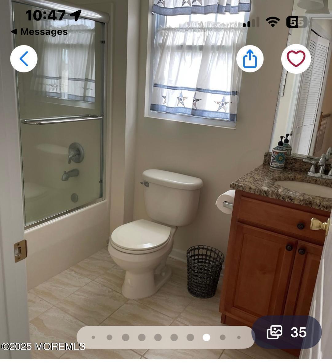 1301 Ocean Boulevard, Unit 1 Seaside Heights, NJ 08751 - Photo 6 of 13 a bathroom with a toilet and a shower