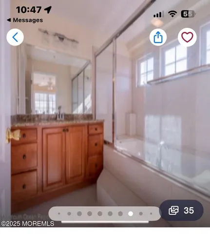 a bathroom with a sink a vanity and a mirror