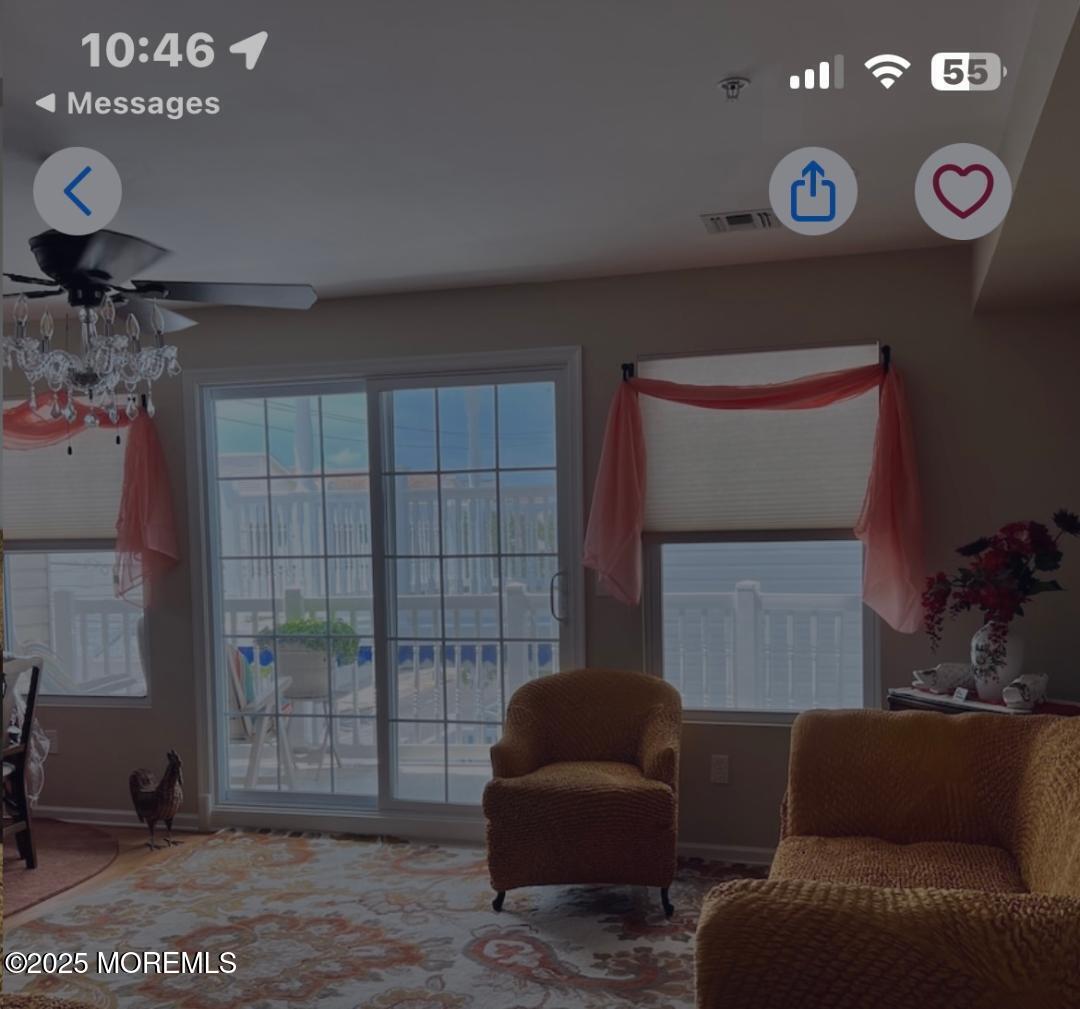 1301 Ocean Boulevard, Unit 1 Seaside Heights, NJ 08751 - Photo 9 of 13 a living room with furniture and a window