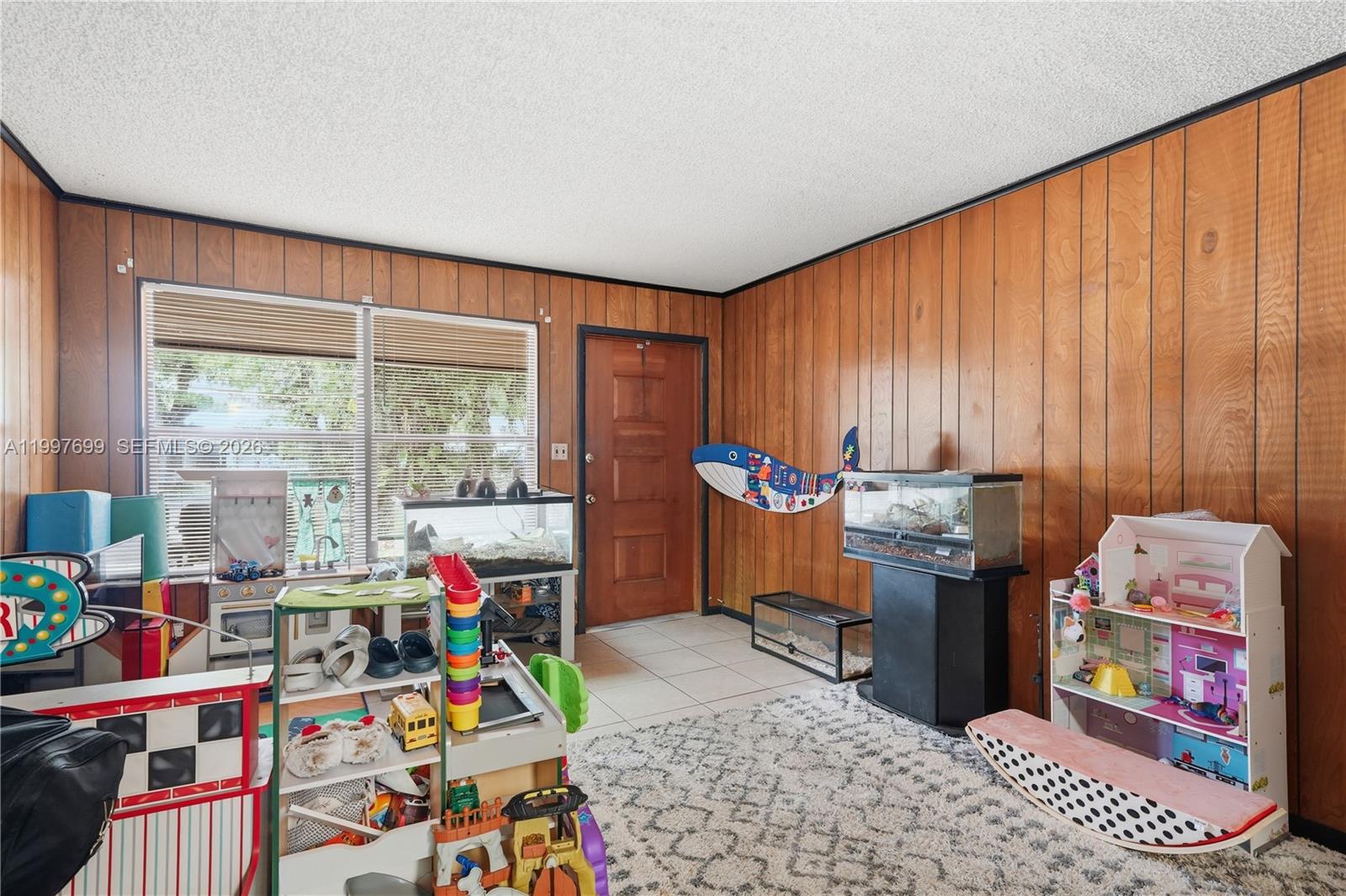 1910 South 34th Street Fort Pierce, FL 34947 - Photo 12 of 24 a children room with furniture and a window