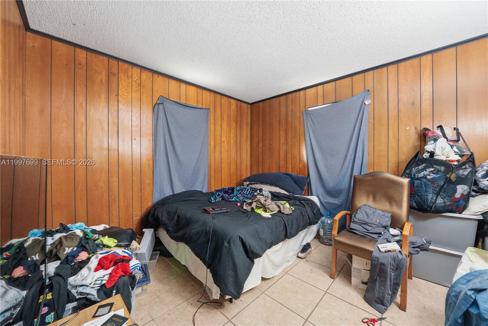 1910 South 34th Street Fort Pierce, FL 34947 - Photo 18 of 24 a bedroom with a bed and a window