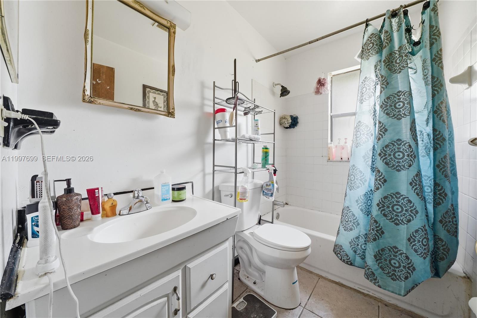 1910 South 34th Street Fort Pierce, FL 34947 - Photo 19 of 24 a bathroom with a sink toilet and shower