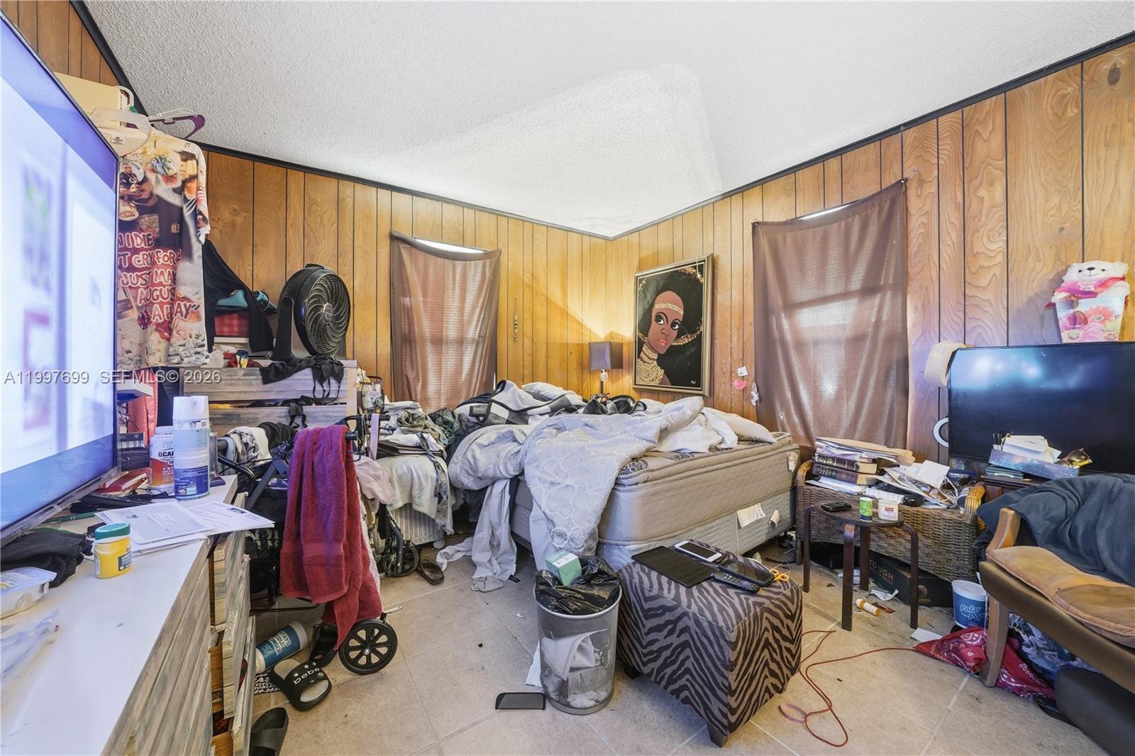 1910 South 34th Street Fort Pierce, FL 34947 - Photo 20 of 24 a bed room with two bed and a chair