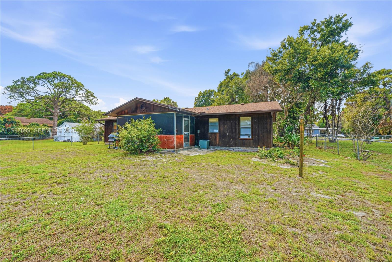 1910 South 34th Street Fort Pierce, FL 34947 - Photo 2 of 24 a front view of a house with a garden