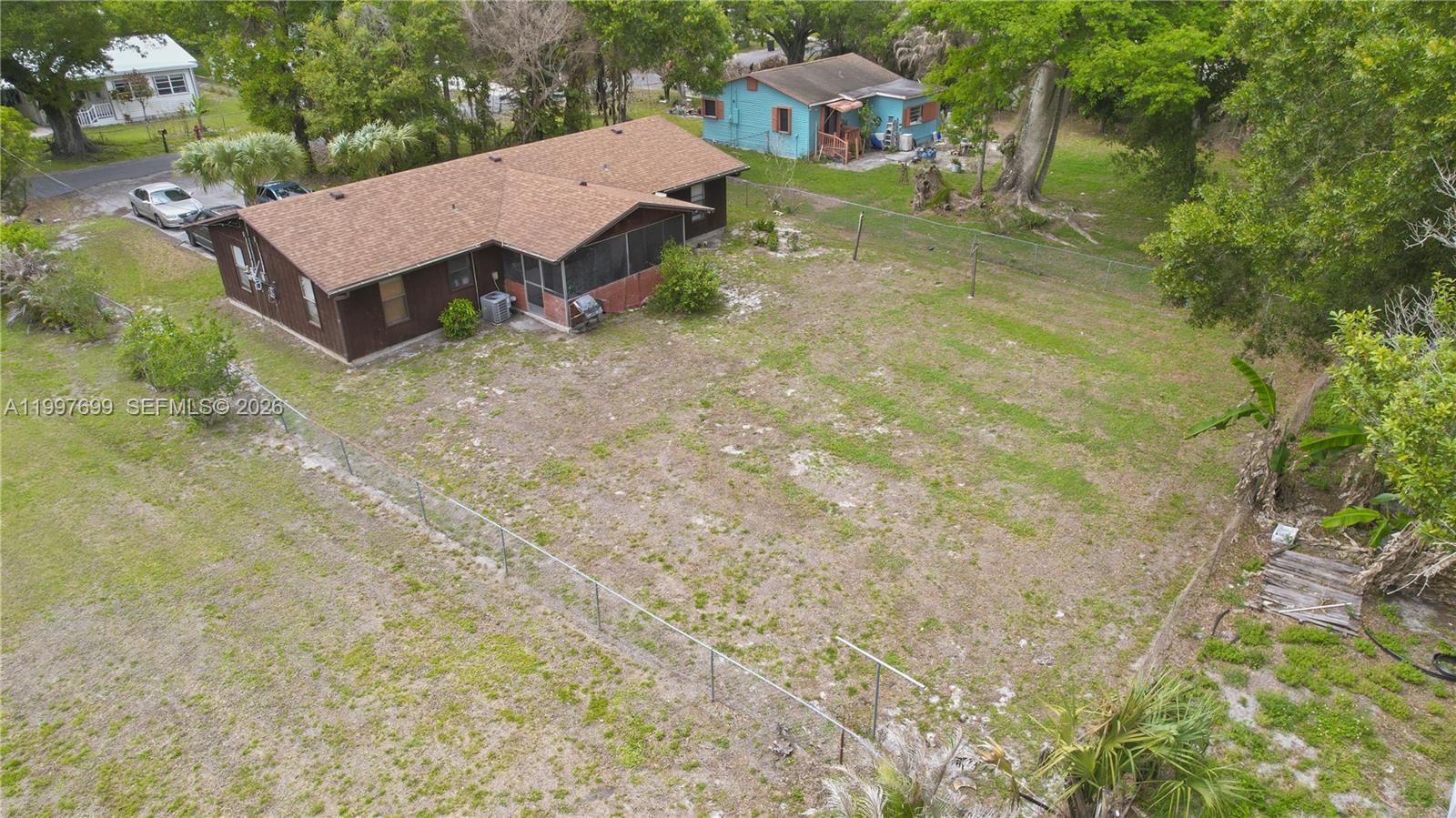 1910 South 34th Street Fort Pierce, FL 34947 - Photo 24 of 24 a view of a house with a yard and large tree