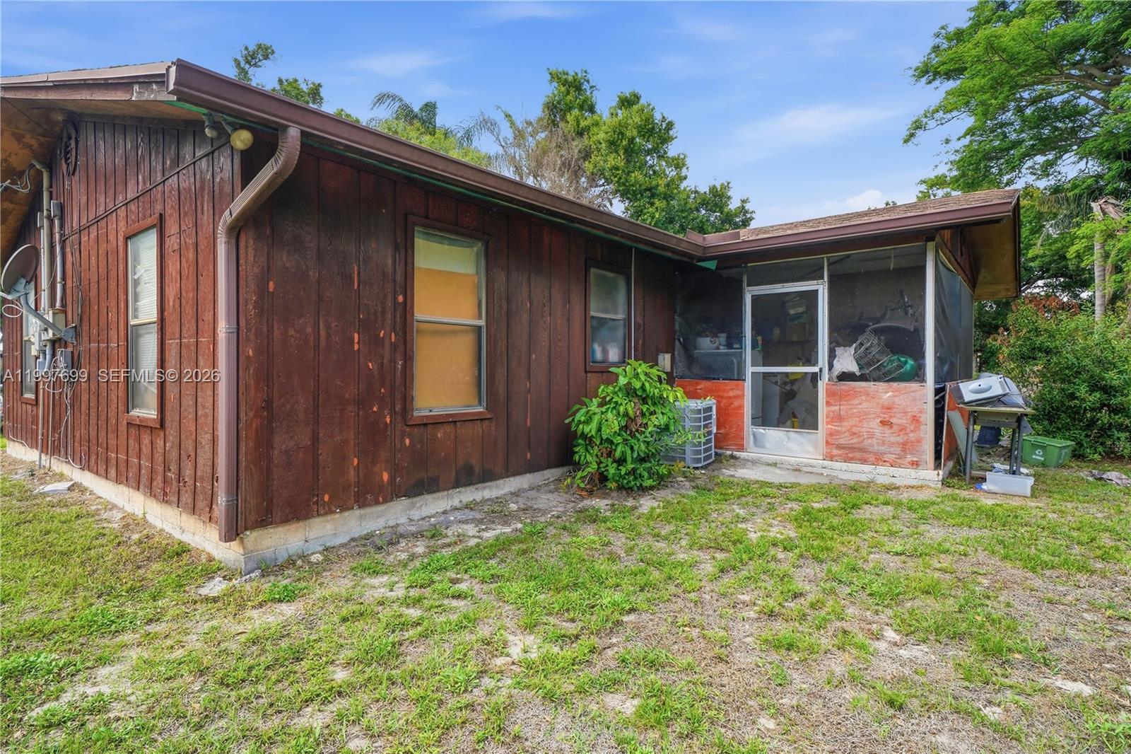 1910 South 34th Street Fort Pierce, FL 34947 - Photo 4 of 24 front view of a house with a yard