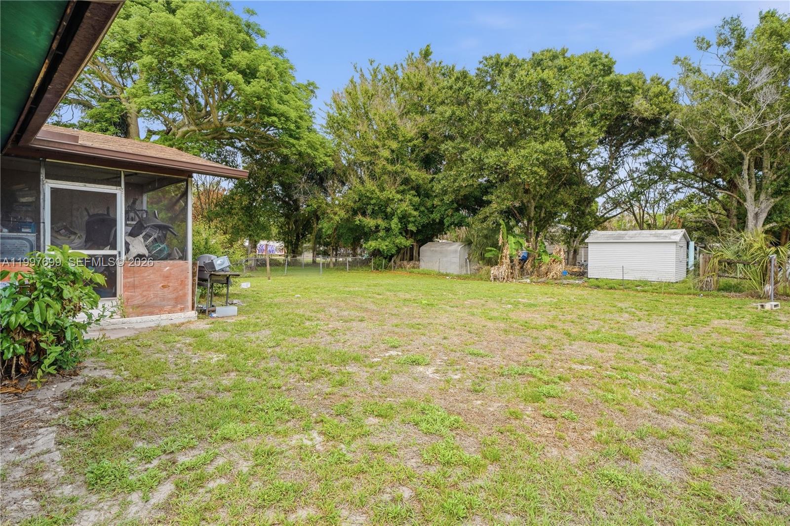 1910 South 34th Street Fort Pierce, FL 34947 - Photo 5 of 24 a front view of a house with a yard