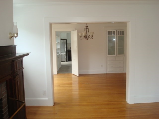 5-7 Abbott Street Wellesley, MA 02482 - Photo 14 of 28 a view of a hallway with wooden floor and staircase