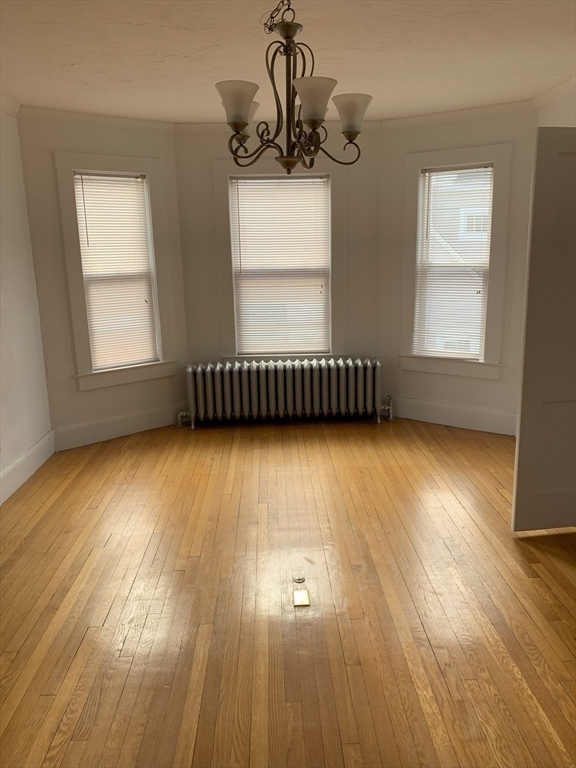 5-7 Abbott Street Wellesley, MA 02482 - Photo 24 of 28 a view of an empty room with wooden floor and a window