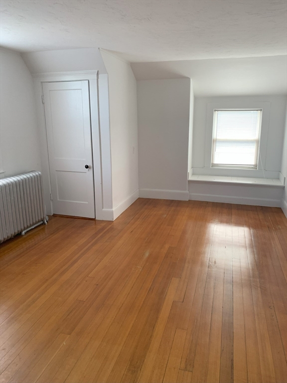 5-7 Abbott Street Wellesley, MA 02482 - Photo 27 of 28 an empty room with wooden floor and windows