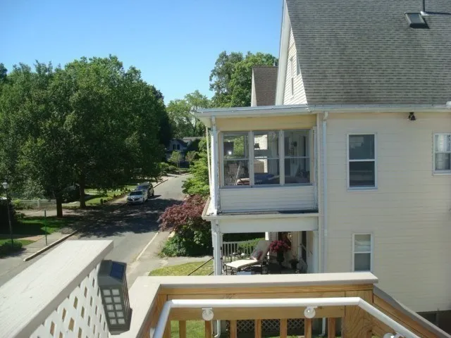 a view of house with outdoor space and sitting area