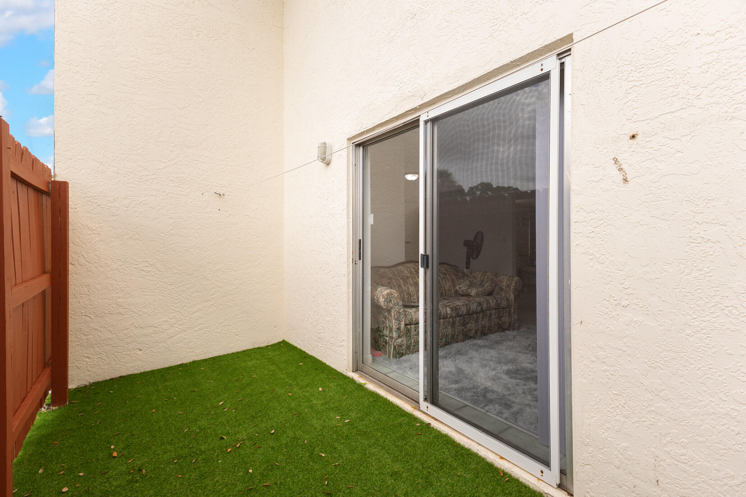 720 Ridge Club Drive, Unit 43 Melbourne, FL 32934 - Photo 10 of 27 Sliding Glass Door to Patio