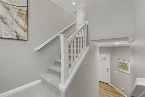 a view of a livingroom with furniture and a window