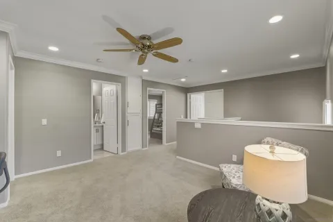 a bedroom with a bed and glass door