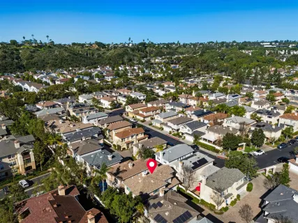 an aerial view of residential houses and lake view