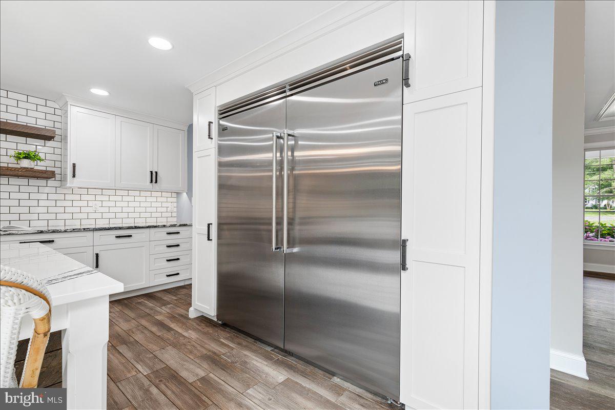 102 Little Neck Road Stevensville, MD 21666 - Photo 9 of 77 a kitchen with cabinets and stainless steel appliances