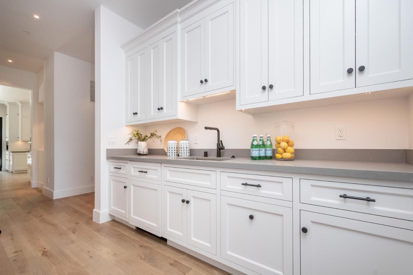 52 Middlefield Road Atherton, CA 94027 - Photo 14 of 45 a kitchen with white cabinets and a sink