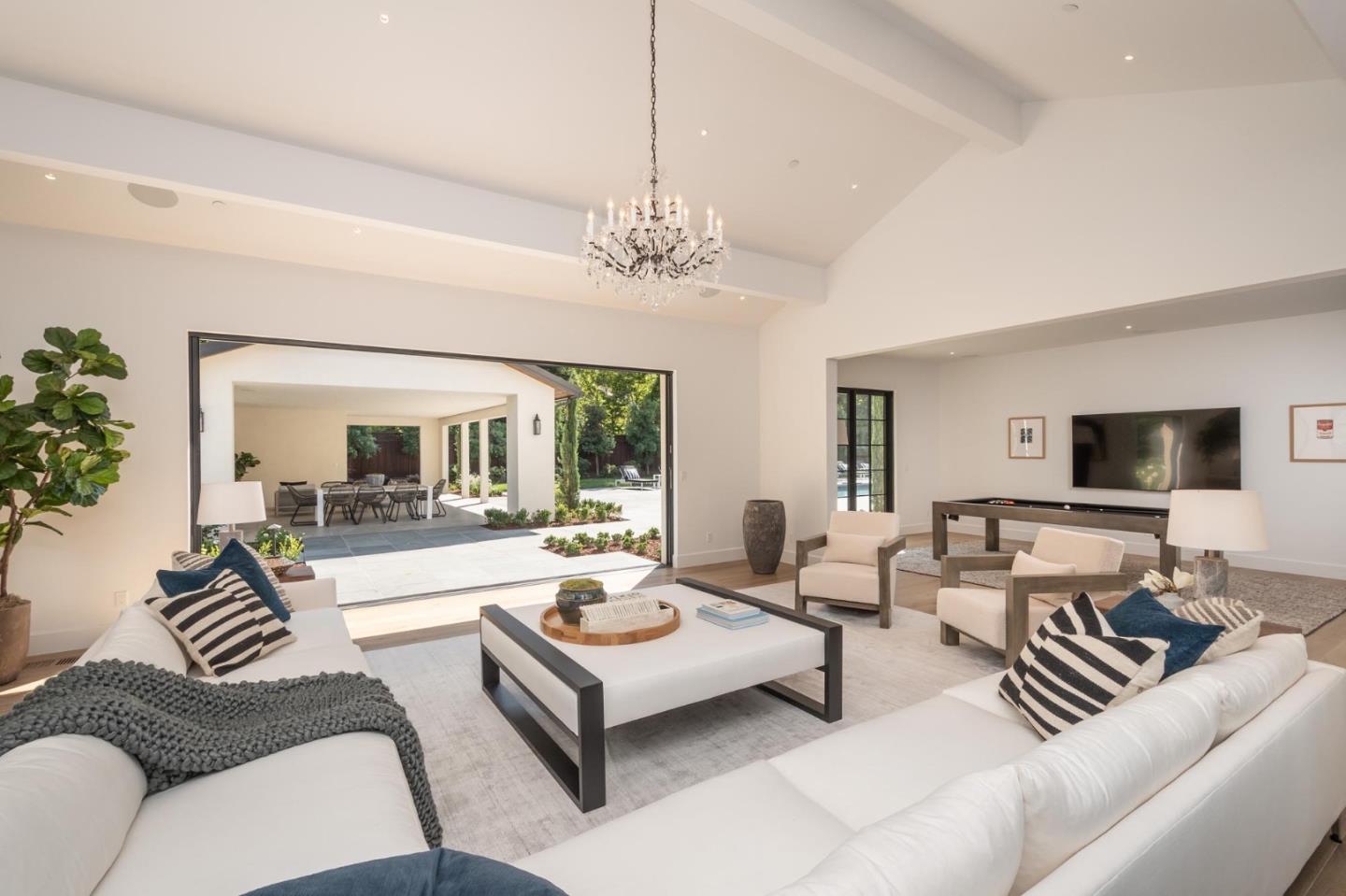 52 Middlefield Road Atherton, CA 94027 - Photo 17 of 45 a living room with furniture or couch and a flat screen tv