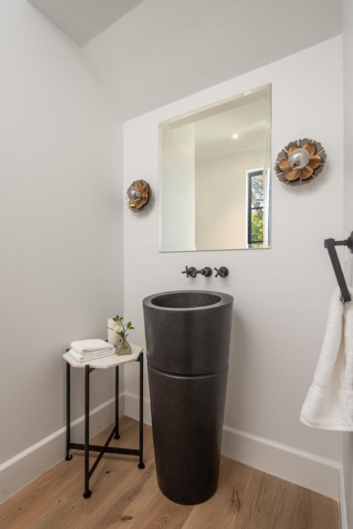 52 Middlefield Road Atherton, CA 94027 - Photo 19 of 45 a room with a table and a potted plant